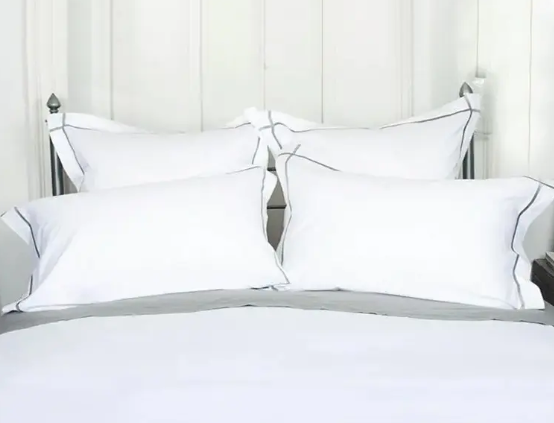 Ano ang magagawa ko kung ang plain cotton sateen sheet ng aking hotel ay nagiging dilaw at maging stiffer sa bawat hugasan?